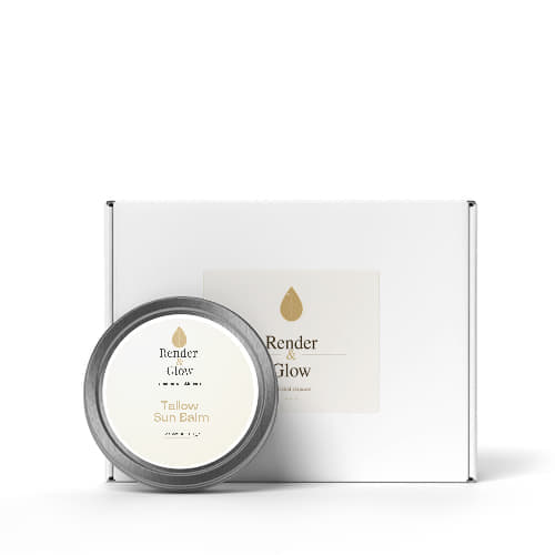 A tin of Render & Glow Tallow Sun Balm sits in front of a matching white box with the same label.
