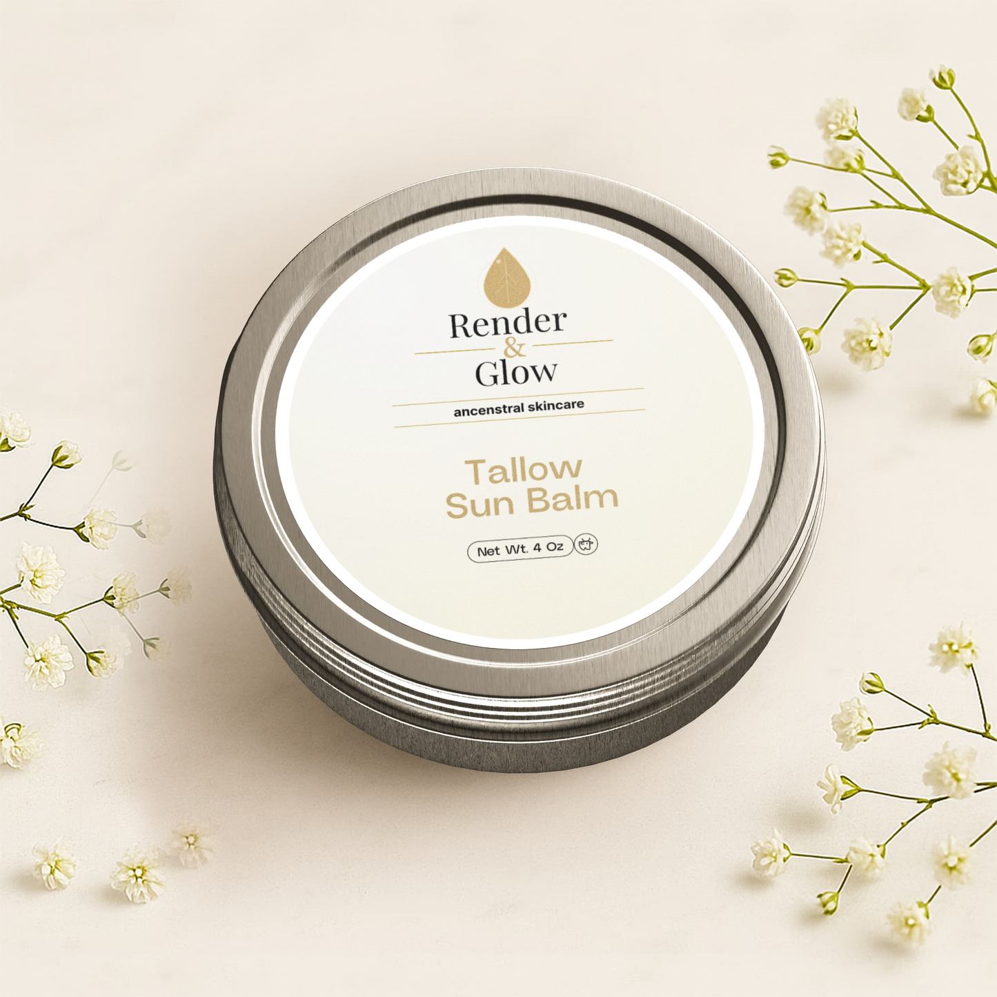 A silver tin of Render & Glow Tallow Sun Balm is surrounded by small white flowers on a beige background.