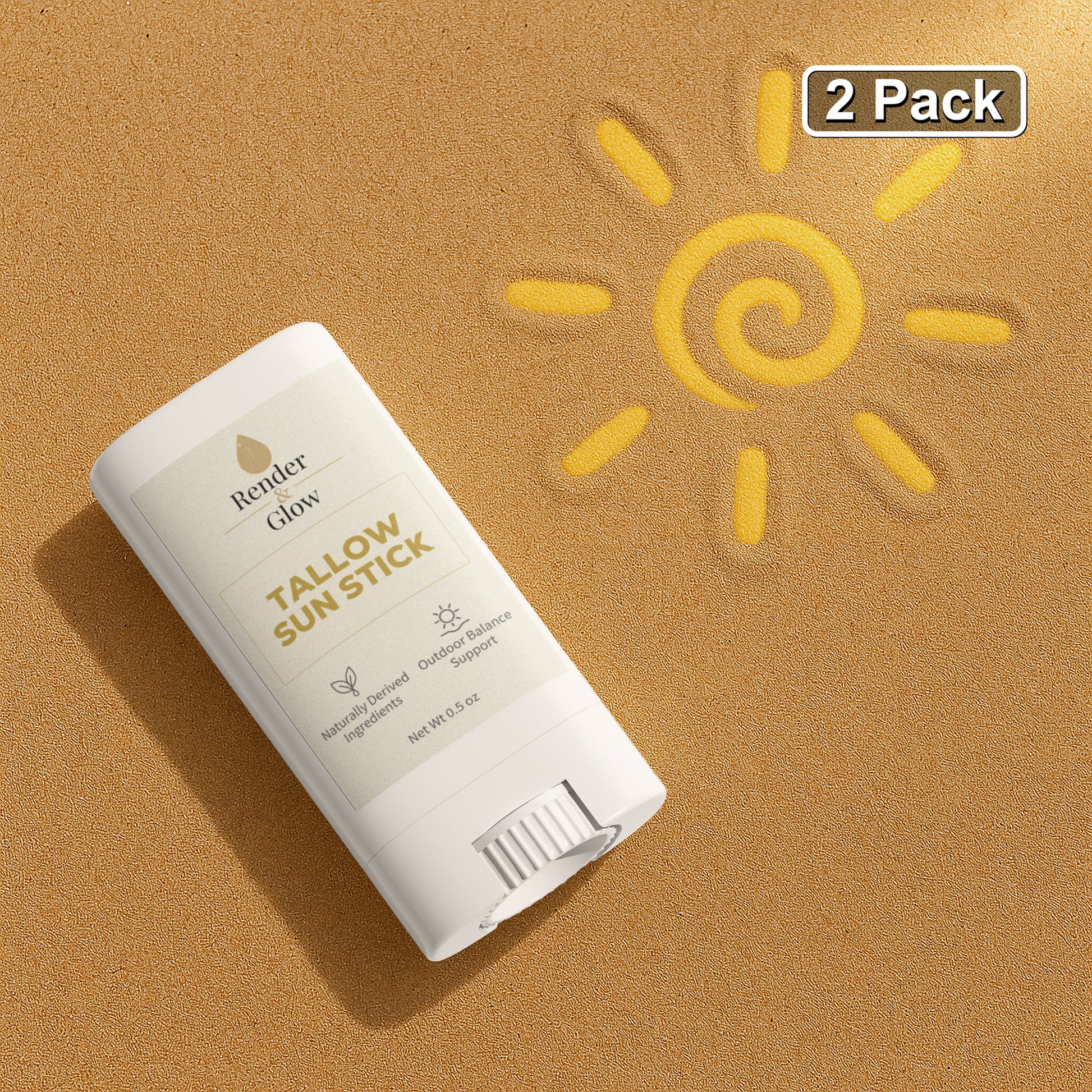 Render & Glow Tallow Sun Stick (2-Pack) rests on sand by a sun drawing; 2-Pack label at top right.