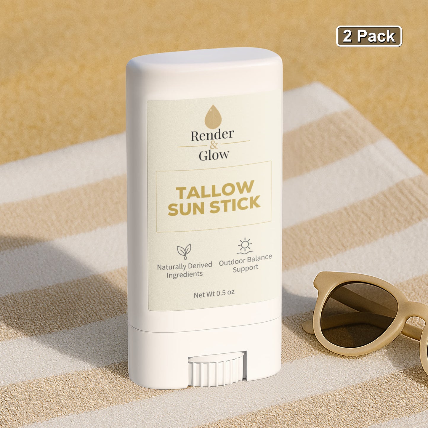 Render & Glow Tallow Sun Stick (2-Pack) mineral balm stick on a towel near sunglasses.
