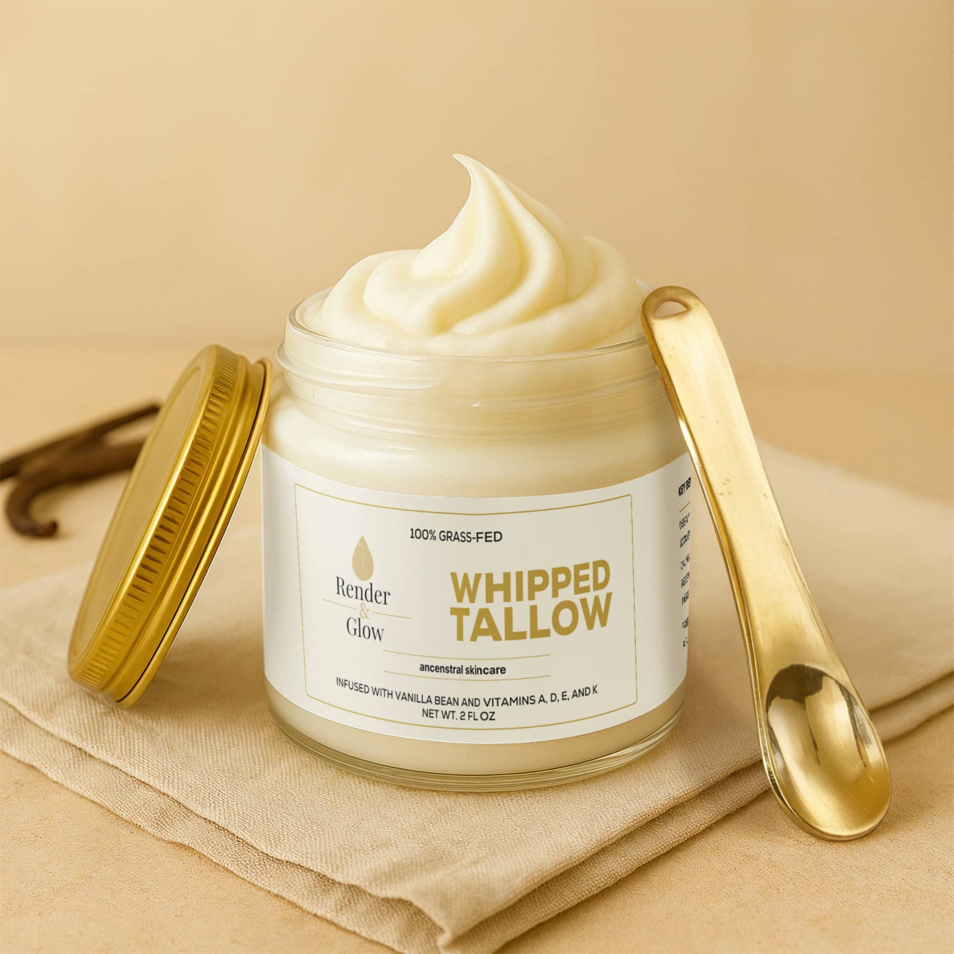 Render & Glow Whipped Tallow Skin Balm with gold lid and spoon, creamy natural moisturizer on beige cloth.